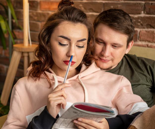 A couple reading a book together. Love Spells That Work Instantly for Him & Her