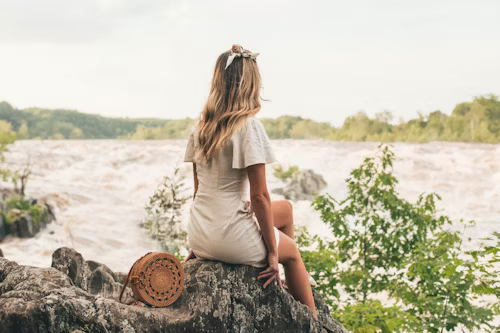 A Woman Sitting on Rock Doing a Paterson’s Great Falls Love Spell New Jersey