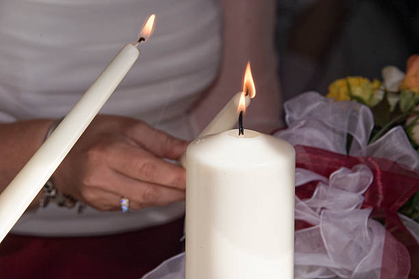 A Woman lighting 3 candles. Best Spell to Save My Marriage