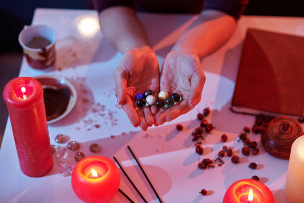 A spellcaster performing a love spell with candles and crystals for immediate results.