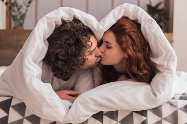 A Couple Kiss Under Sheets After Ordering Best Love Spells Sydney