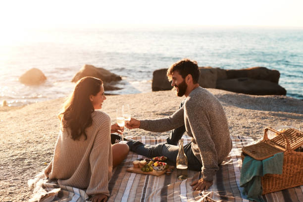 A Couple sitting on beach shores after doing Best Love Spells in Australia