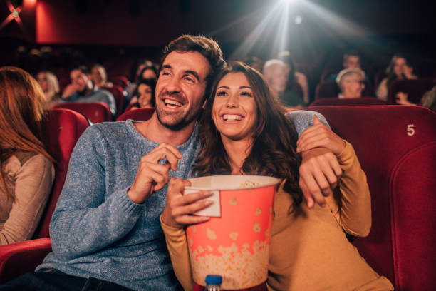 A Couple in Cinema eating Popcorns. Best Love Spells in Melbourne