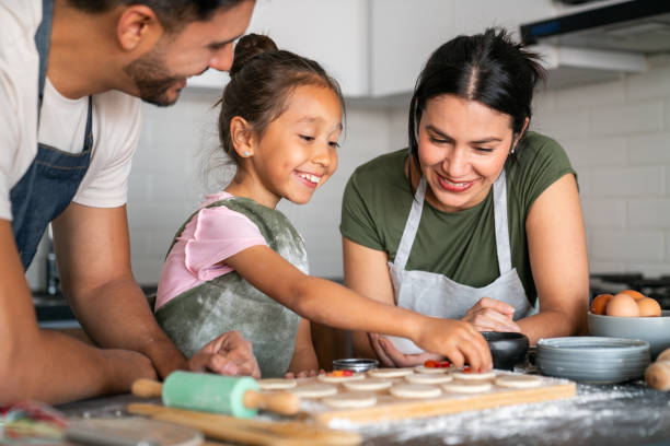 A Couple cooking with their daughter. Love Spells in Tennessee