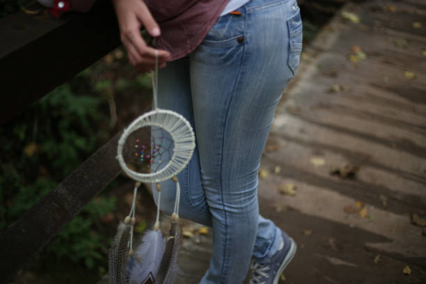 A Woman Holding Dream Catcher. Protection Spells