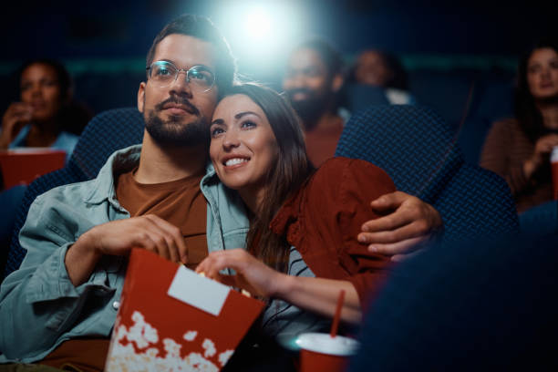 A Couple in Cinema Watching a Movie After Using Best Love Spells in Sydney