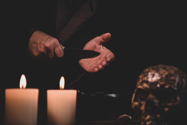 Love Spells in Roswell: Relationship Guidance for Couples Growing Together 8 Spellcaster's hand holding a knife. Best Love Spell Caster in Georgia