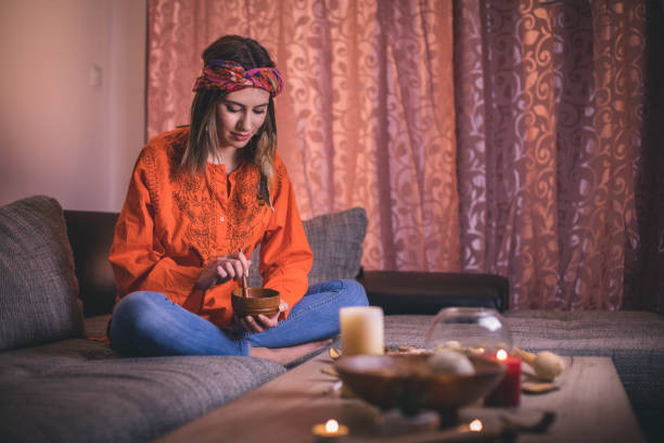 How to Cast a Love Spell at Home: Beginner Guide 3 A Woman Casting A Spell in a Living Room. How to Cast a Love Spell at Home