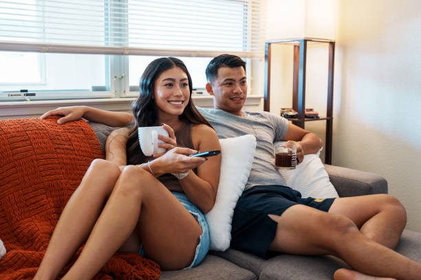 Love Spells in Roswell: Relationship Guidance for Couples Growing Together 3 A Couple watch netflix together on a couch. Love Spells in Roswell, GA