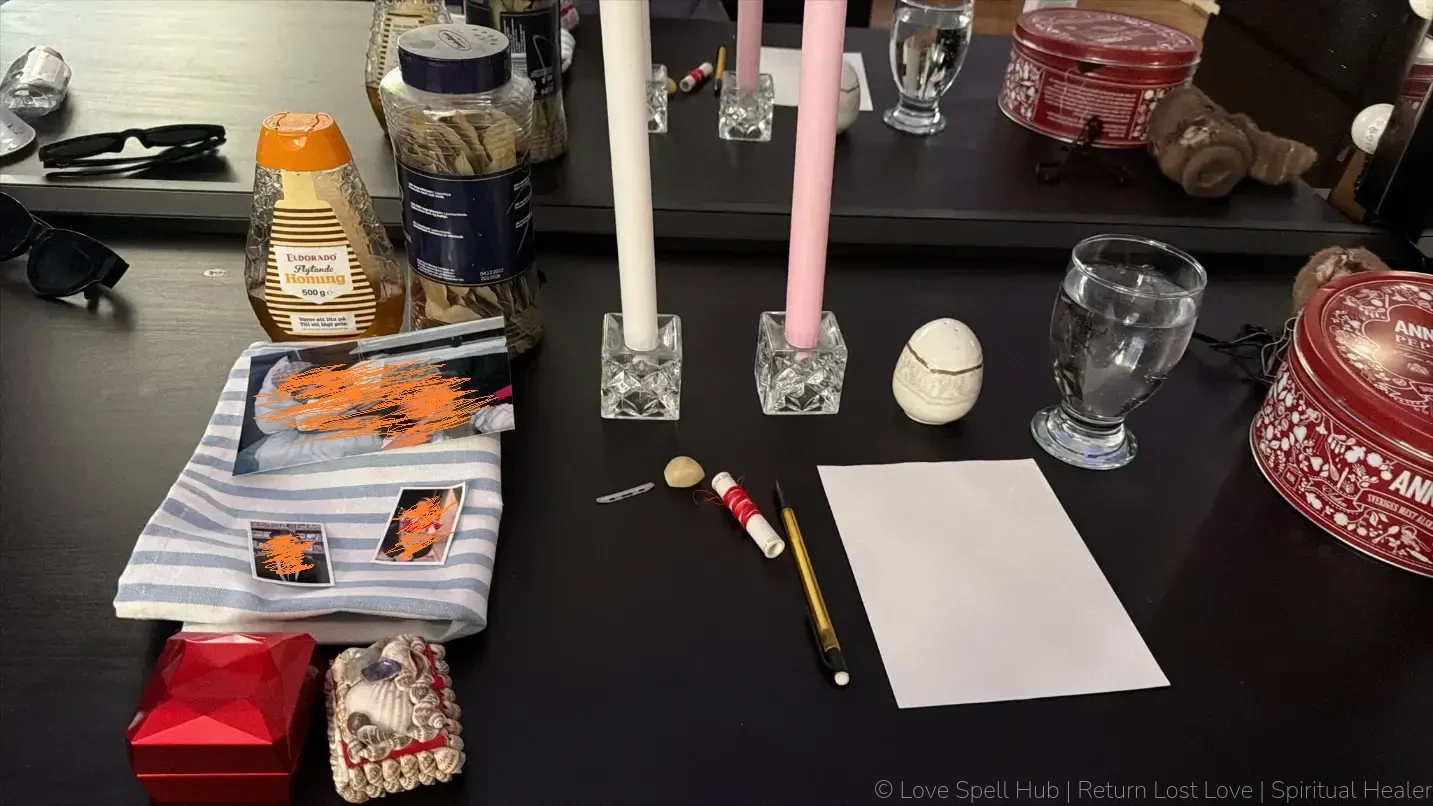 Traditional shrine altar with pink and white candles, honey, a red box, a glass of water, and bay leaves for marriage spells