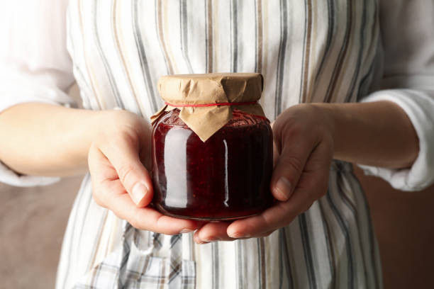 A Woman Holding A Sweetening Jar Spell