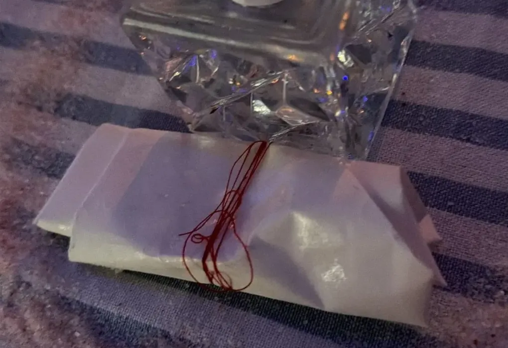 Binding spells traditional altar ritual with red thread and white candle