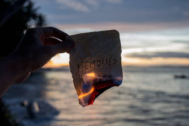Divorce Ritual Ideas 5 Person burning old letters as part of a divorce healing ritual