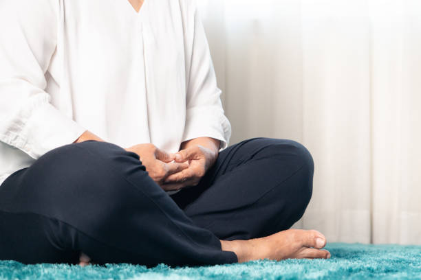 Divorce Ritual Ideas 10 Person meditating during a divorce closure ceremony.