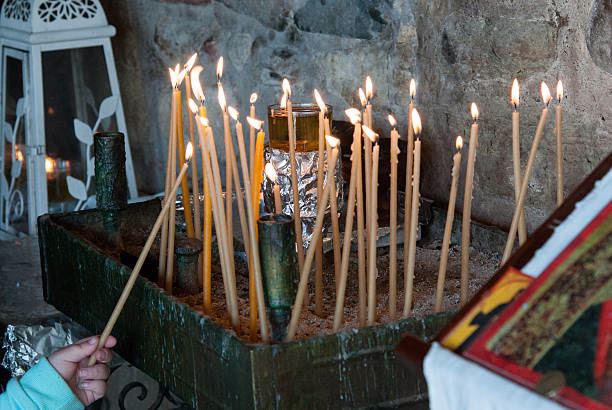 Isa Batha performing a love spell ritual with candles and herbs in Texas