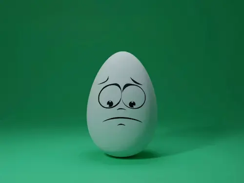 Love Spells Without Ingredients: Simple Tool-Free Rituals You Can Try at Home 8 An egg with an art of frown face to represent no ingredient love spells