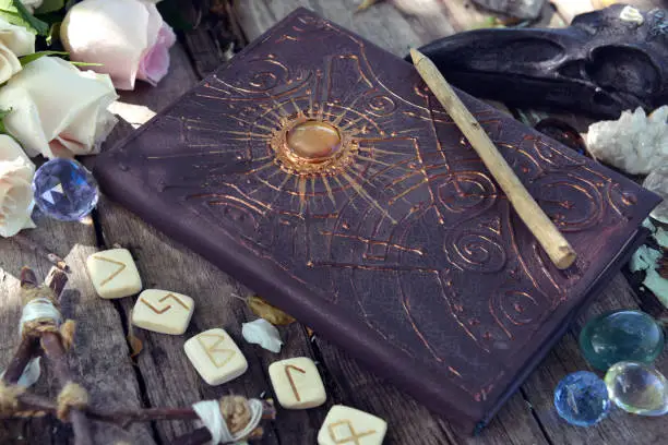 Ancient grimoire glowing with runes