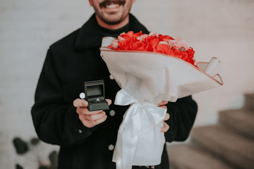 Powerful Love Spells in Palm Springs 2 Man smiling at engagement ring after Batha's Palm Springs obsession love spell worked