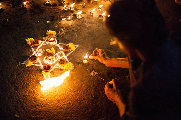 Traditional Mauritian love spell caster in Mauritius lighting sacred candles