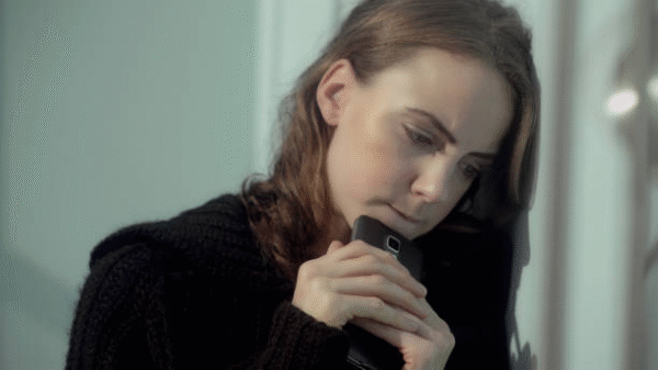 Woman crying and holding a photo after breakup – best love spells UK and love spells that work overnight UK to bring back ex