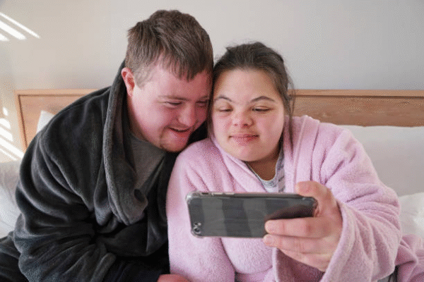 Effective Love Spells in Northern Suburbs Cape 3 A C ouplw watching a movie together on their phone after using Effective Love Spells in Northern Suburbs Cape