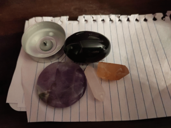 Performing binding spells for protection using crystals and herbs