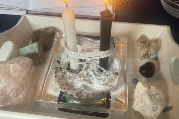 Prof. Batha performing powerful love spells in Atlanta with candles and herbs