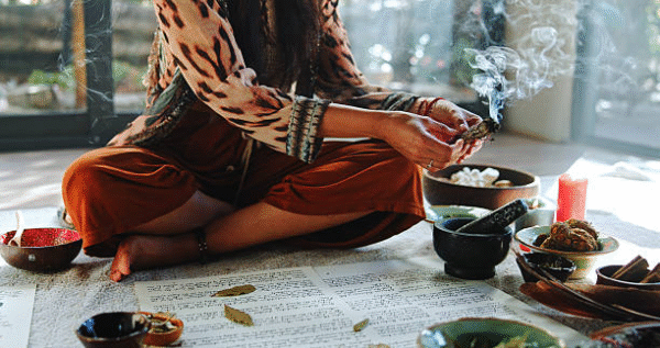 Sangoma in Tembisa performing spiritual cleansing with herbs and candles