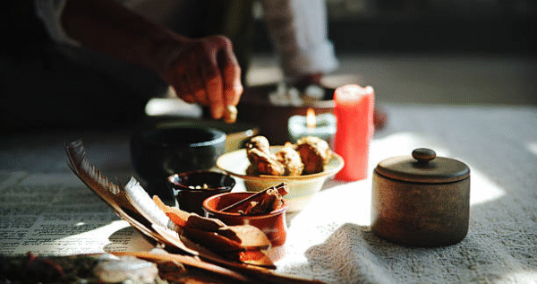 Sangoma in Turffontein performing spiritual cleansing with herbs and candles