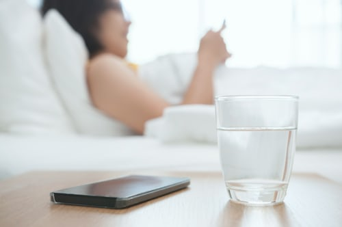 Powerful Call Me Now Spell: The Ultimate Guide for 2025 6 Glass of water beside phone for call me now spell