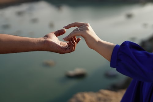 How Do You Know If Someone Is Trying to Put a Spell on You: 7 Signs Batha Swears By 5 Person shaking hands with energy aura effect – how do you know if someone is trying to put a spell on you and energy transfer signs