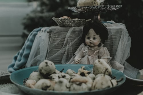 Voodoo Spell Caster That Works 2 Voodoo doll on table with protective crystals – how do you know if someone is trying to put a spell on you and safeguard your energy