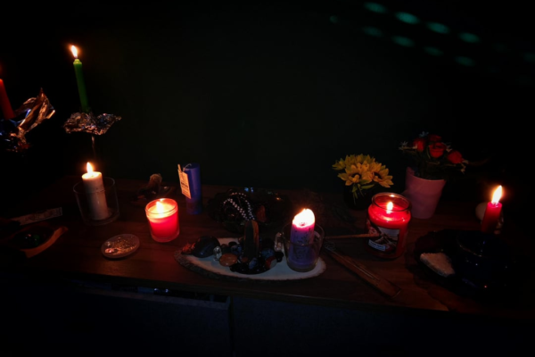 Spell to Keep Husband ritual with candles and rose petals