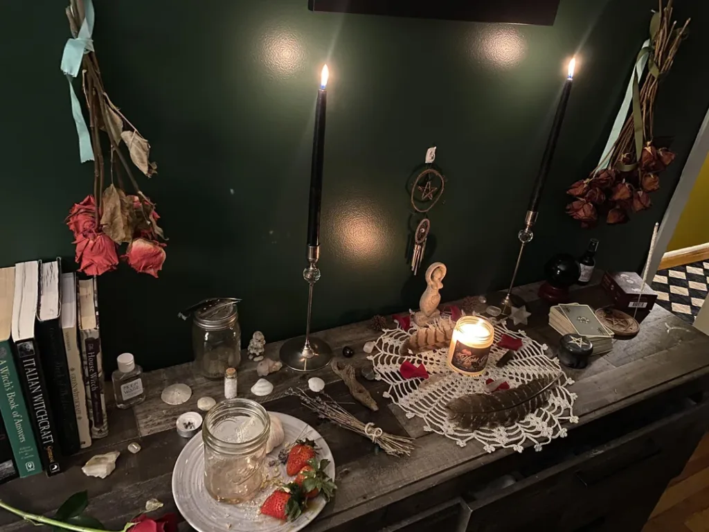 Love spell ritual setup in Birmingham with candles and written intentions