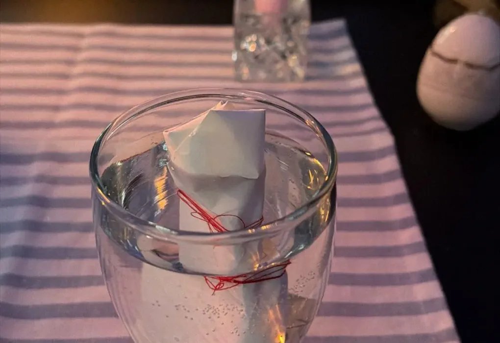 Domination love spells traditional altar with pink candle and glass of water